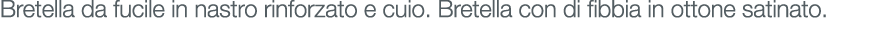 Bretella da fucile in nastro rinforzato e cuio. Bretella con di fibbia in ottone satinato.